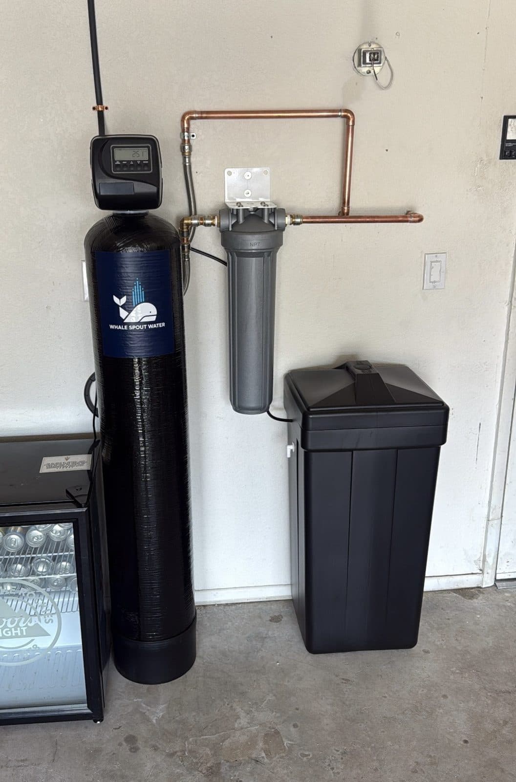 Water softener with a sediment pre-filter and brine tank installed to stop hard water scale