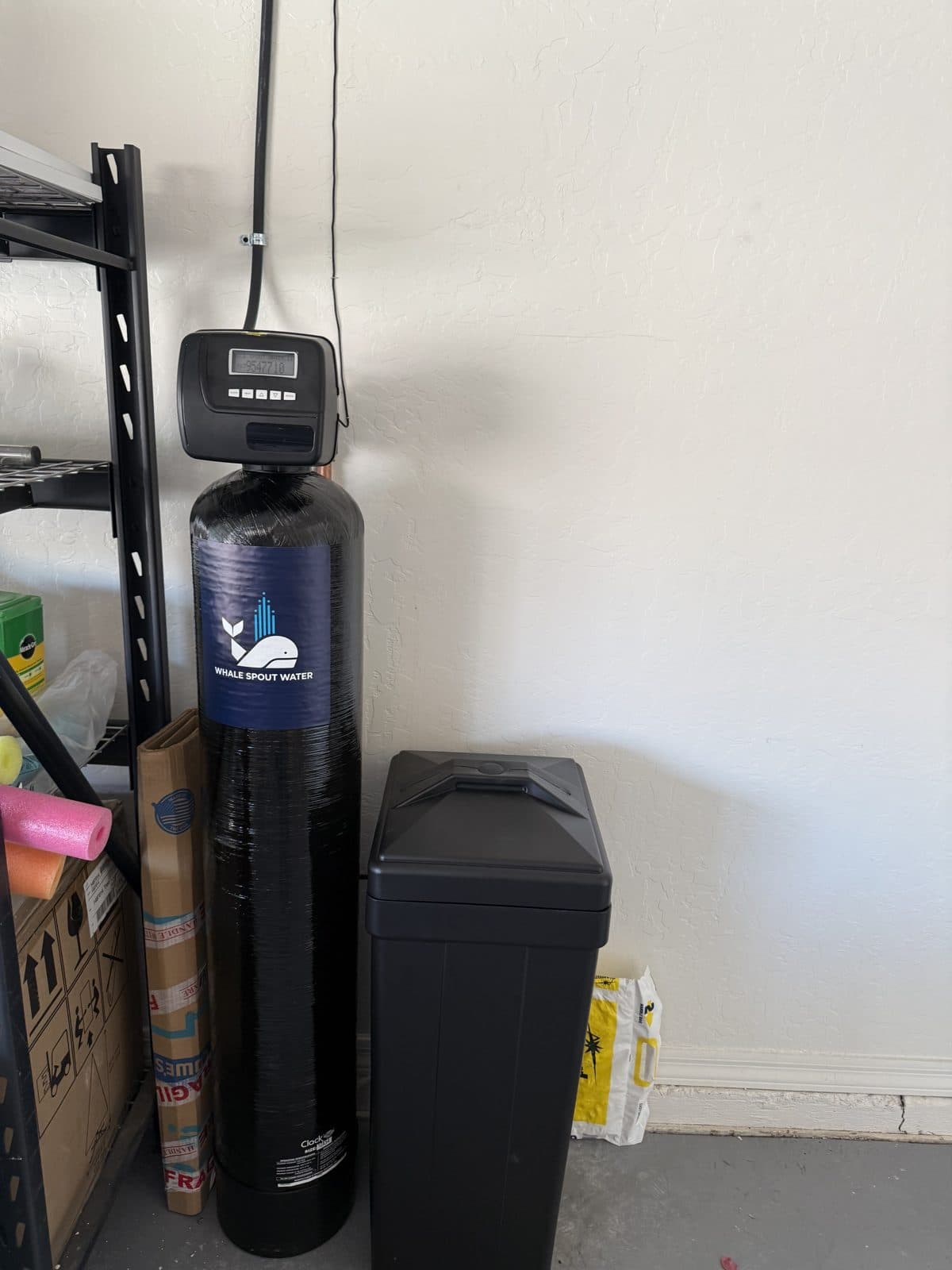 Whole-home water softener with digital control valve installed in an Arizona garage